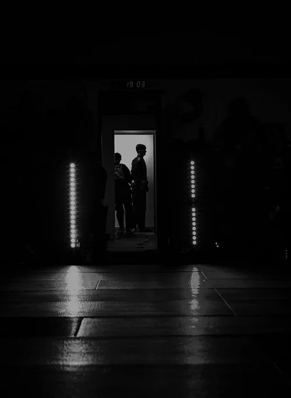 Athletes silhouetted in tunnel before walkout